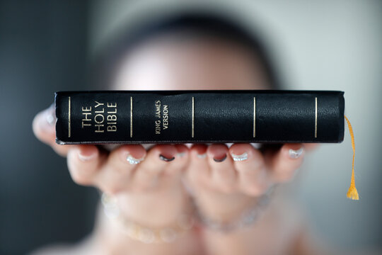 Catholic woman with the Holy Bible in hands, Vietnam, Indochina