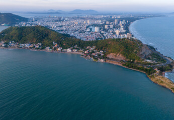 Aerial view of Vung Tau city, Vietnam, panoramic view of the peaceful and beautiful coastal city behind the statue of Christ the King standing on Mount Nho in Vung Tau city.