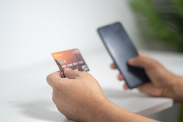 Businessman uses credit card to shop online, pay