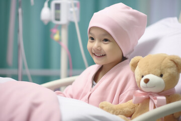 A girl, a cancer patient with a pink scarf covering her head and a radiant smile, seated on the hospital bed. With a positive and hopeful attitude, with a teddy bear by her side.copy space