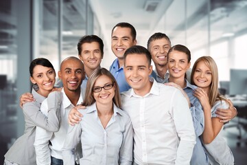 A large team of business people standing in office