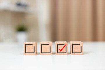 Wooden cubes with check mark icon. Human resource. Quality Control. Task list goals success. Check...