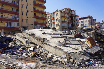 The condition of buildings collapsed and completely destroyed, walls split, infrastructure and...