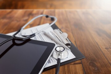 Medical hospital setting, stethoscope and documents