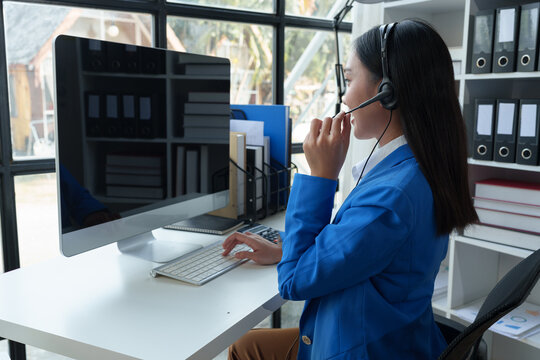 Asian call center girl working to provide customer service through online communication channels, business operator providing customer service online Communicate business information to customers.