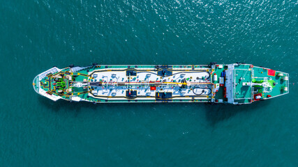 Aerial top view LPG gas ship, Ship tanker gas LPG top view on the sea for transportation, Liquefied Petroleum Gas tanker or LPG anchored in deep blue ocean sea.