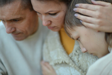 Portrait of a family of three on the nature