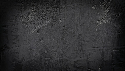 Fototapeta premium A close-up view of a dark grey, rough-textured concrete wall, black painted background wall textured