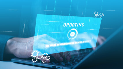 Businessman diligently updates software systems on a laptop, ensuring that the pulse of his business resonates with the latest technology advancements and thrives in the dynamic realm of online data.