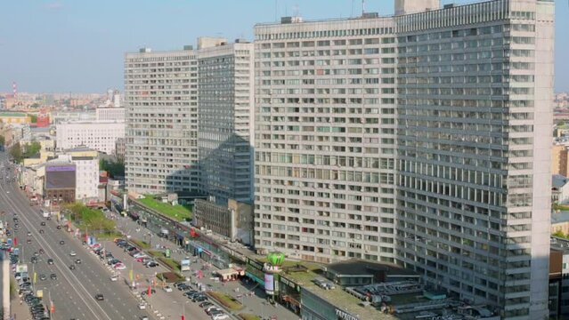 City traffic on New Arbat street near corner shape houses 