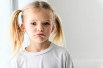 Negative human emotions, reactions and feelings. shot of moody displeased angry little girl