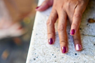 Details of nail polish on a woman's fingers