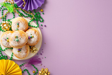 Dynamic Party Ensemble: Top view photo capturing essence of Mardi Gras with carnival food, feather, fans, ribbon stars, beads garlands, sweet donuts on a festive purple surface. Ample space for text © ActionGP