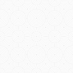 Seamless trendy pattern of circles and arcs, geometric white shapes for textiles and wallpaper. Festive Christmas pattern on a gray background.