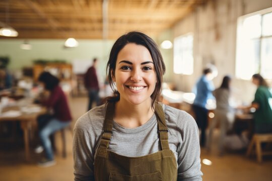 Portrait Of A Smiling Woman Volunteer In Workshop