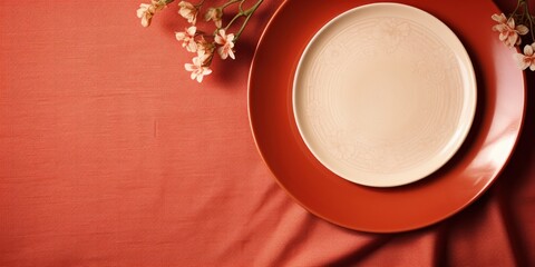 Obraz na płótnie Canvas A plain plate against a checkered cloth, suggesting a home meal