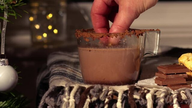 Dunking cookie in Hot Chocolate drink 