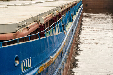 Fototapeta premium Yaroslavl region, Russia, July 9, 2023. Fragment of the side of an old dry cargo ship.
