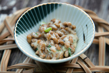 Nattō, nato or hiragana is a traditional Japanese food made with fermented soybeans.traditional Japanese food made with fermented soybeans.