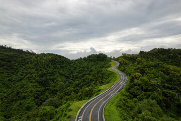 Road on mountain which a lot of road curve very popular landmark for tourist in Nan province, Thailand.