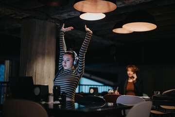 Business professionals working late at night, analyzing sales statistics and planning for business...
