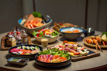 Assorted gourmet Japanese cuisine on table. Traditional Asian food and dining.