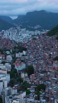 Cantagalo and Pavao-Pavaozinho Favelas. Rio de Janeiro, Brazil. Aerial View. Orbiting. Vertical Video