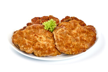 Wiener schnitzel in breadcrumbs, isolated on white background.