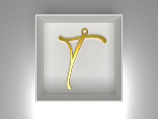 A gold pendant in the shape of an "T" rests in a white box on an equally white background, elegant and simple