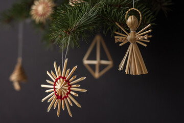 Christmas decorations are made of straw. Christmas decor. Small depth of field