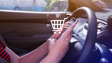 Shopping Online. Using Smartphone shopping online in car. shopping cart and business icons with...