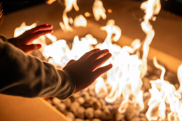 hands of a person with a fire