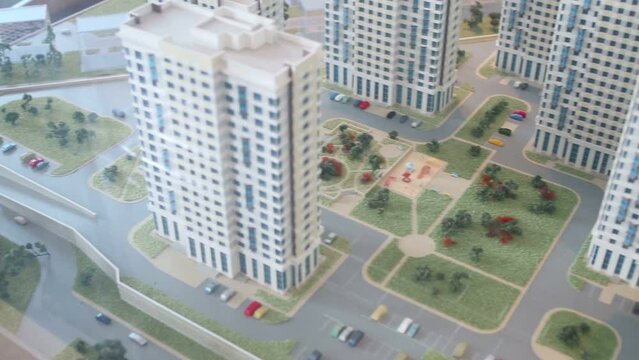 Layout of buildings and courtyard with playground and parking