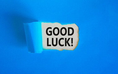 Good luck symbol. Concept words Good luck on beautiful white paper. Beautiful blue table blue background. Business, motivational good luck concept. Copy space.