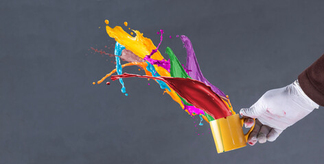 Throwing multi colored paint splashes - paint emulsion advertisement theme