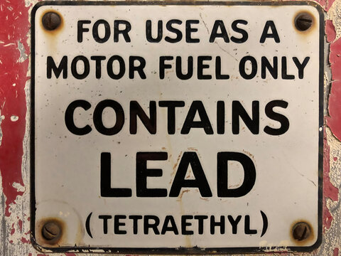 Vintage gas pump lead tetraethyl sign environment