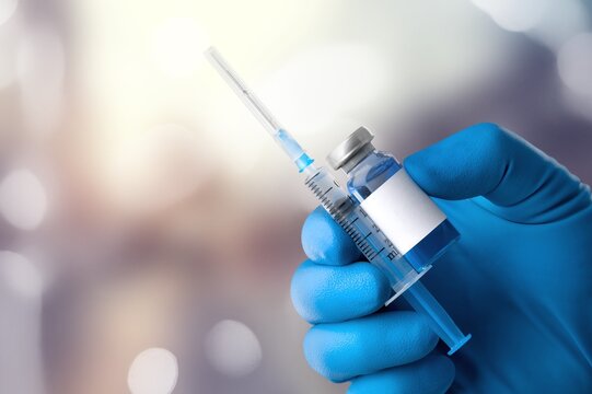 Professional doctor hold injection for treatment.