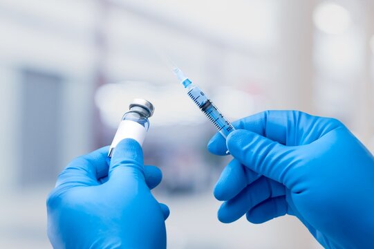 Professional doctor hold injection for treatment.