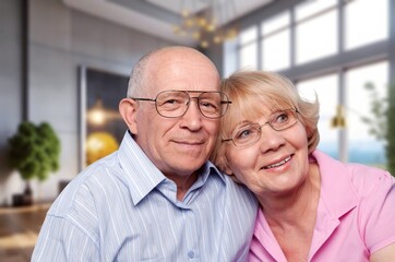 Dreamy senior loving family couple at home