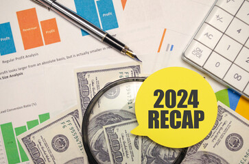 2024 RECAP on yellow sticker with pen and calculator
