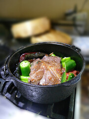 Braised beef pot roast with  jalapenos and Mexican chilis .