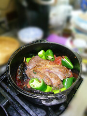 Braised beef pot roast with  jalapenos and Mexican chilis .