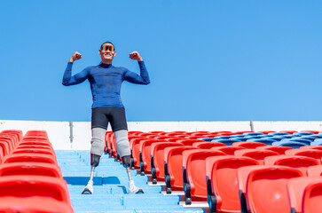 Side view of sport man athlete prosthesis legs stand on stairs with action of happy and celebration...