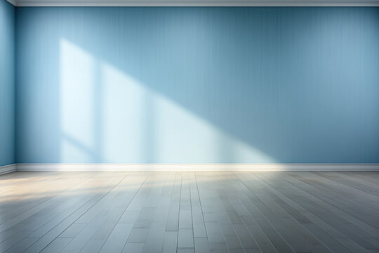 Empty room with blue wall, sunrays and wooden floor.