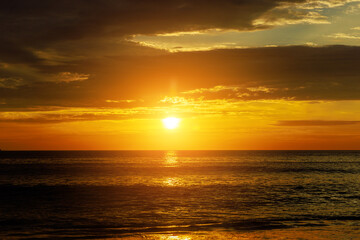 Early in morning, when sun is rising over waves of ocean, there is majestic sight