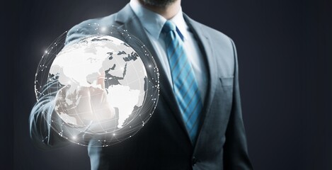 Hand pushing globe earth button