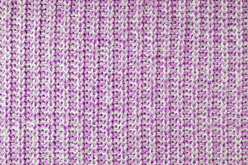 Jersey textile background , pink white melange knitted wool fabric. Woolen knitwear, sweater, pullover surface texture, textile structure, cloth surface, weaving of knitwear material