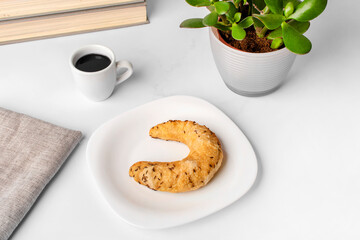 Fresh pastry with coffee on the breakfast table.