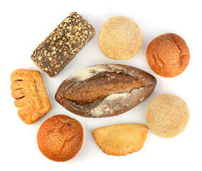 Beautiful baked bread and buns isolated on white. Top view.