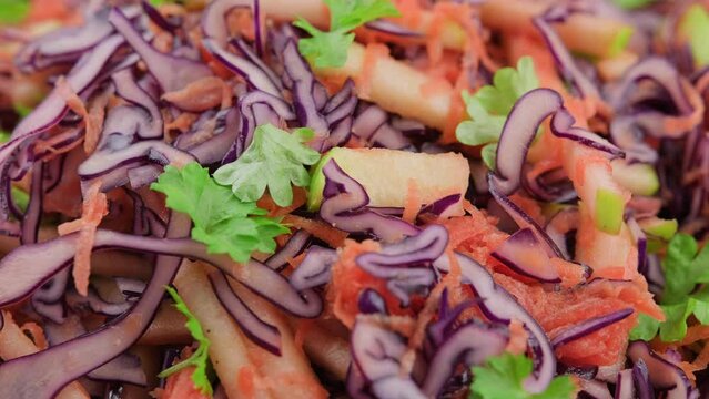 Red Cabbage salad with apples and carrots. Rotating video